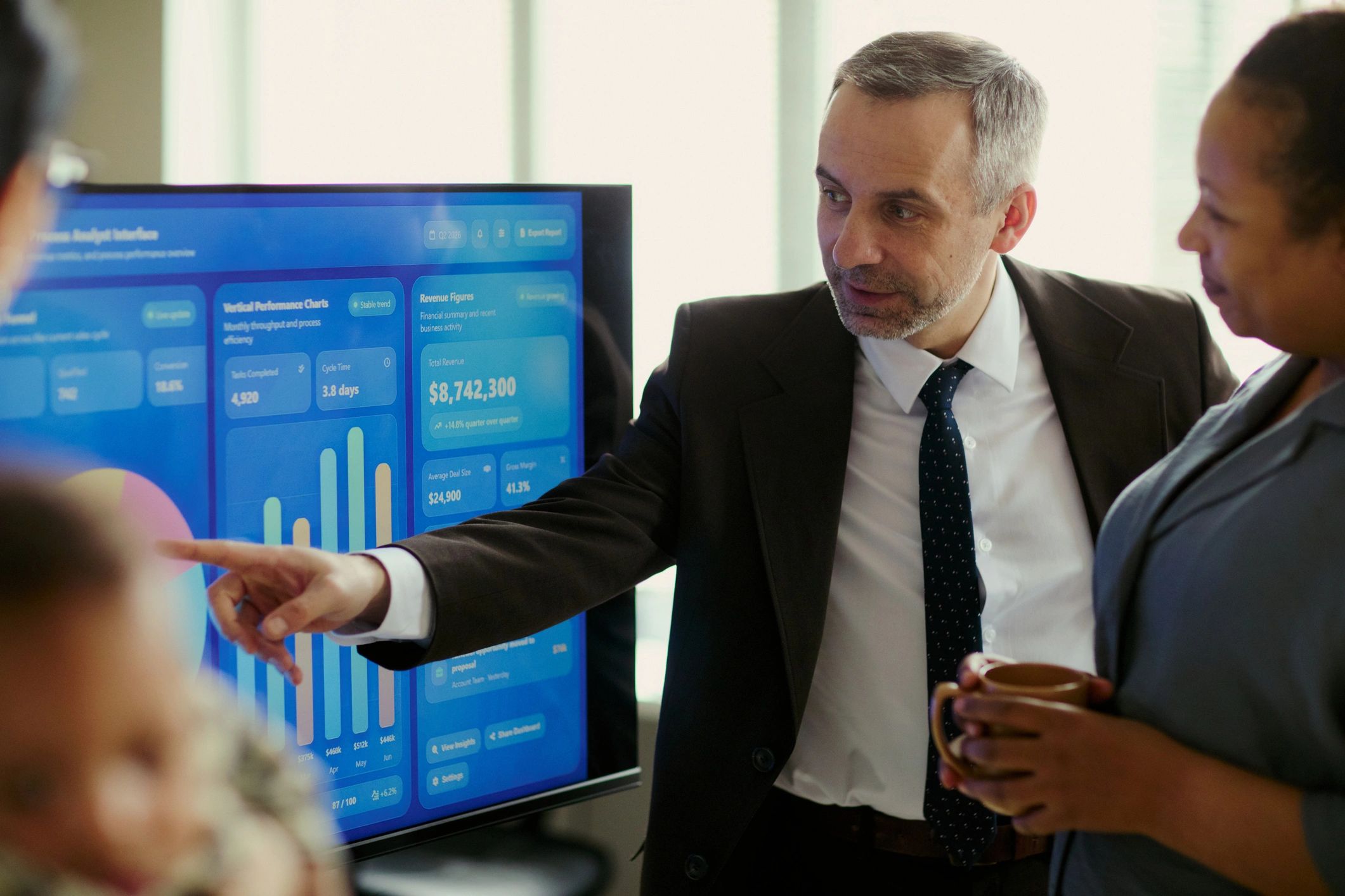 Presenter reviewing business data with a team